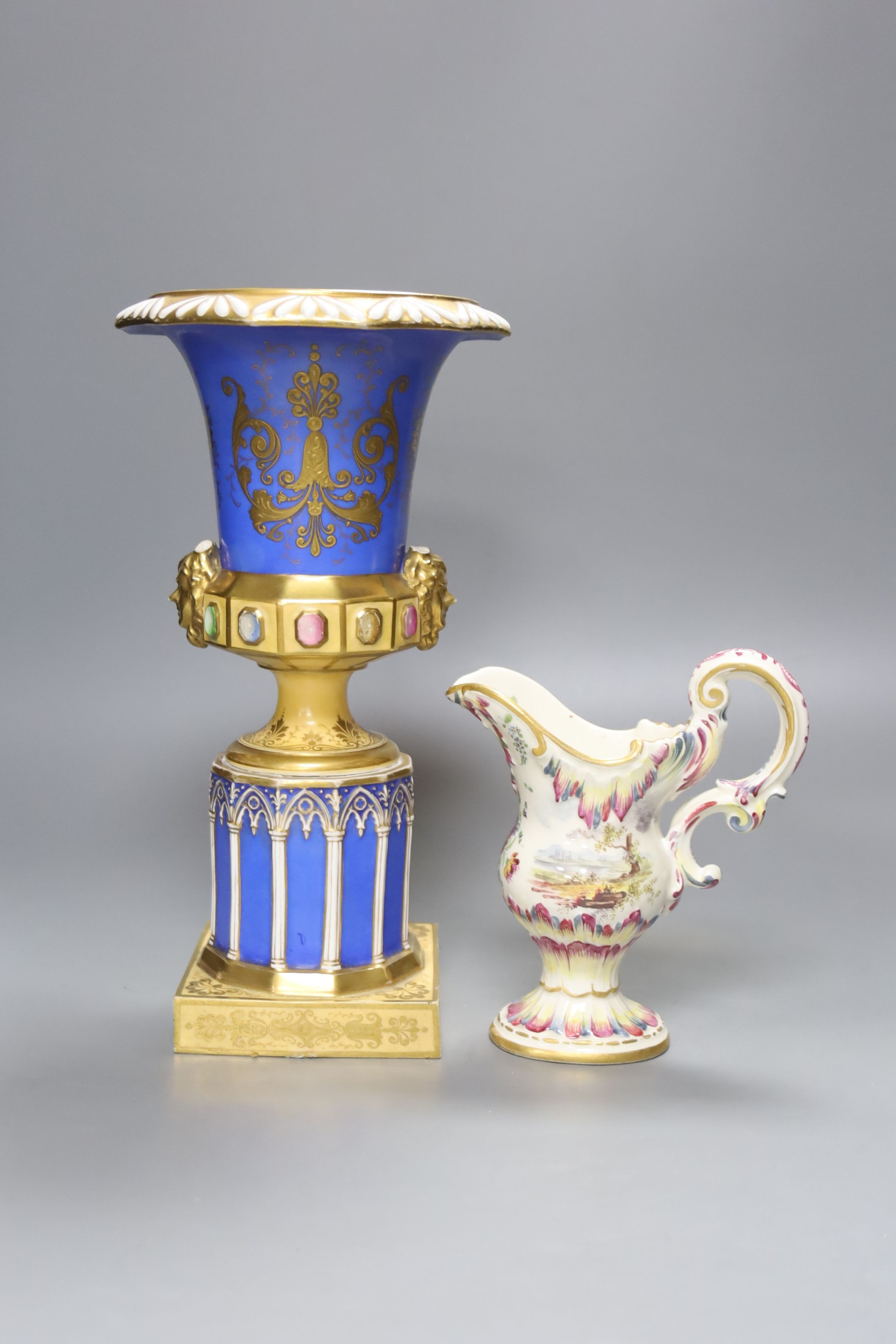 A 19th century French blue ground vase and a Lille faience cream jug, tallest 27cm